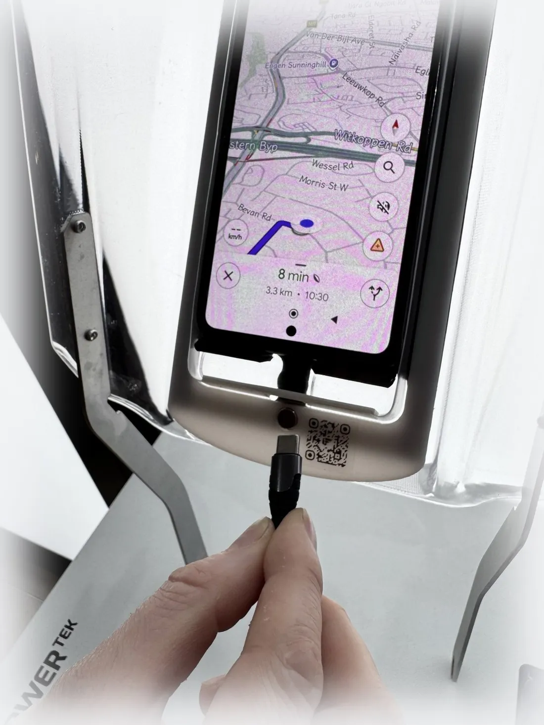 USB-C charging cable connecting through the EyesUp dock's cable pass-through